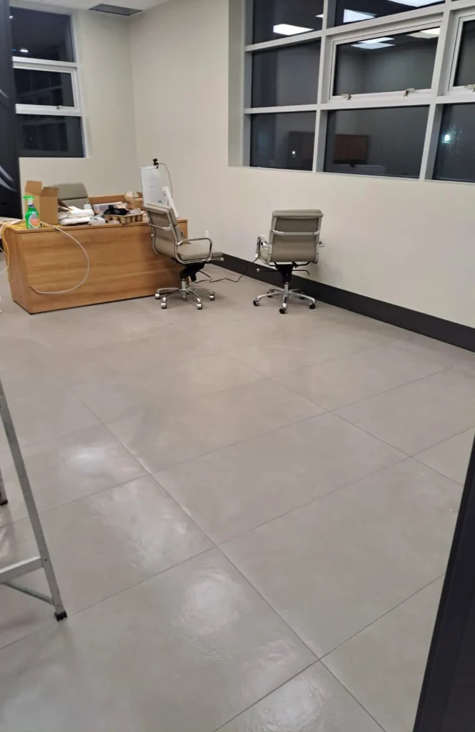 After: clean glossy tile floor in the same office room